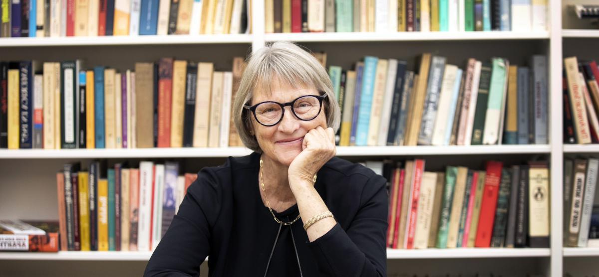 Drew Gilpin Faust with a bookshelf in the background